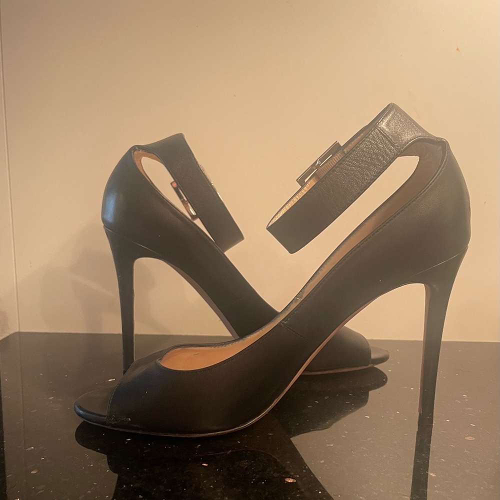 Very gently worn Jimmy Choo black peep toe ankle strap 4 inch heel. Classic